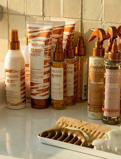 Assorted hair care products on a shelf with a comb.